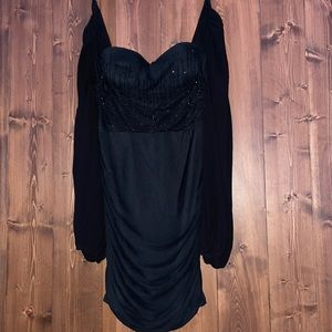 Black, mesh long sleeve, short dress with black shiny jewels on front and back.